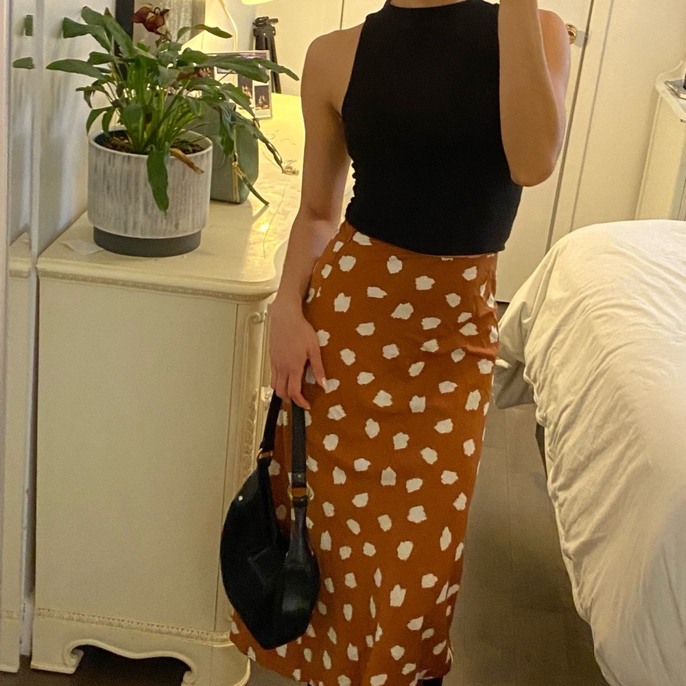 "Long camel-colored skirt”
